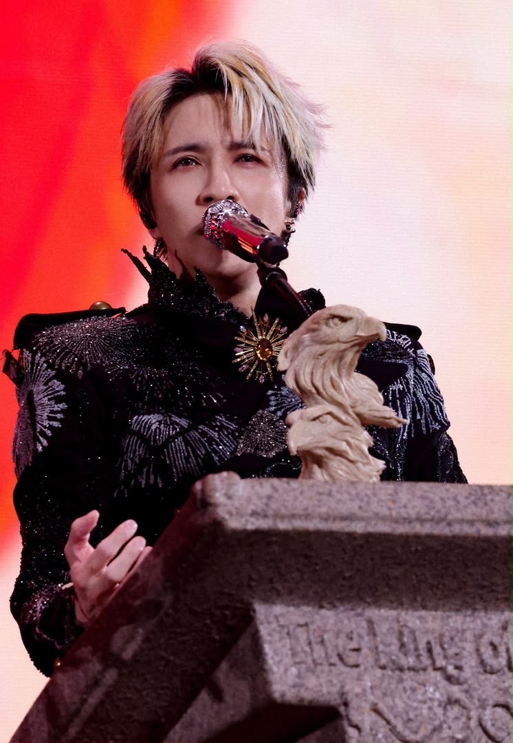 Bai Lu Joker Xue in black grain de poudre wool tuxedo with fire embroideries by Julien Fournié